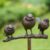 Gartenfiguren kaufen: Gartenstecker Vogelgruppe Bronze